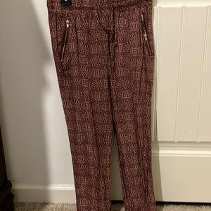 Breezy, thin bohemian pants with draw string and zipper pockets.